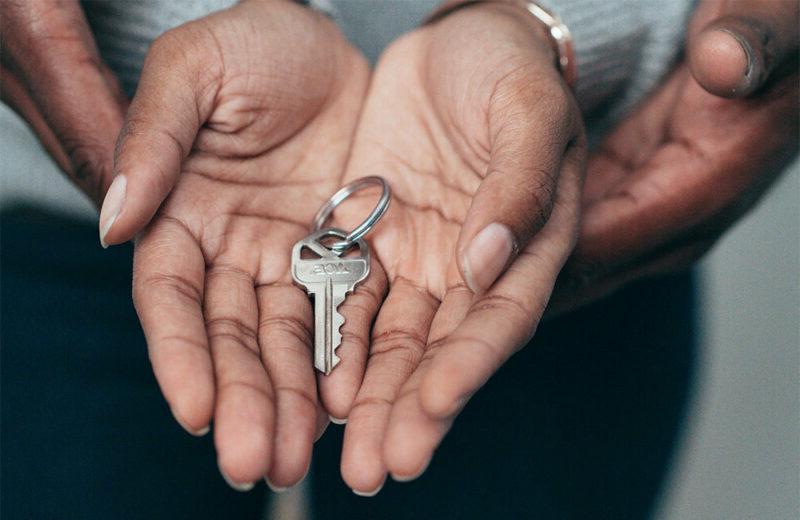 couple holding house keys in their hands
